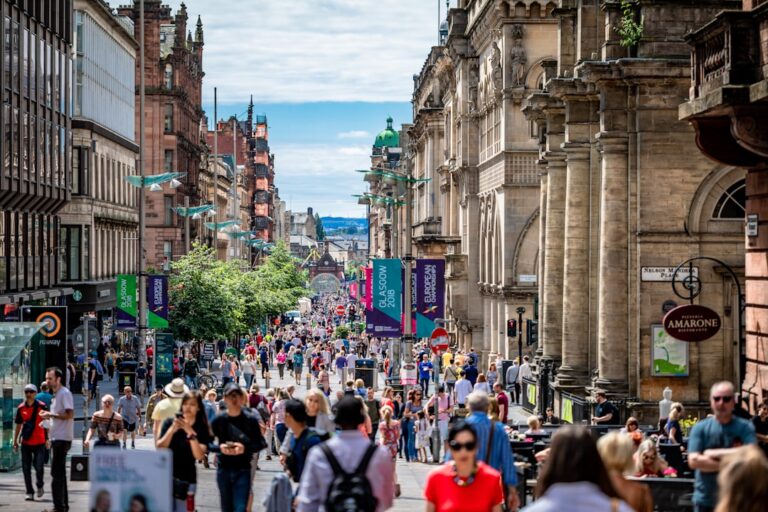 A street in Glasgow lined with sandstone buildings